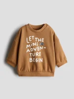 دورس نوزادی کاراملی جلو نوشته H&M