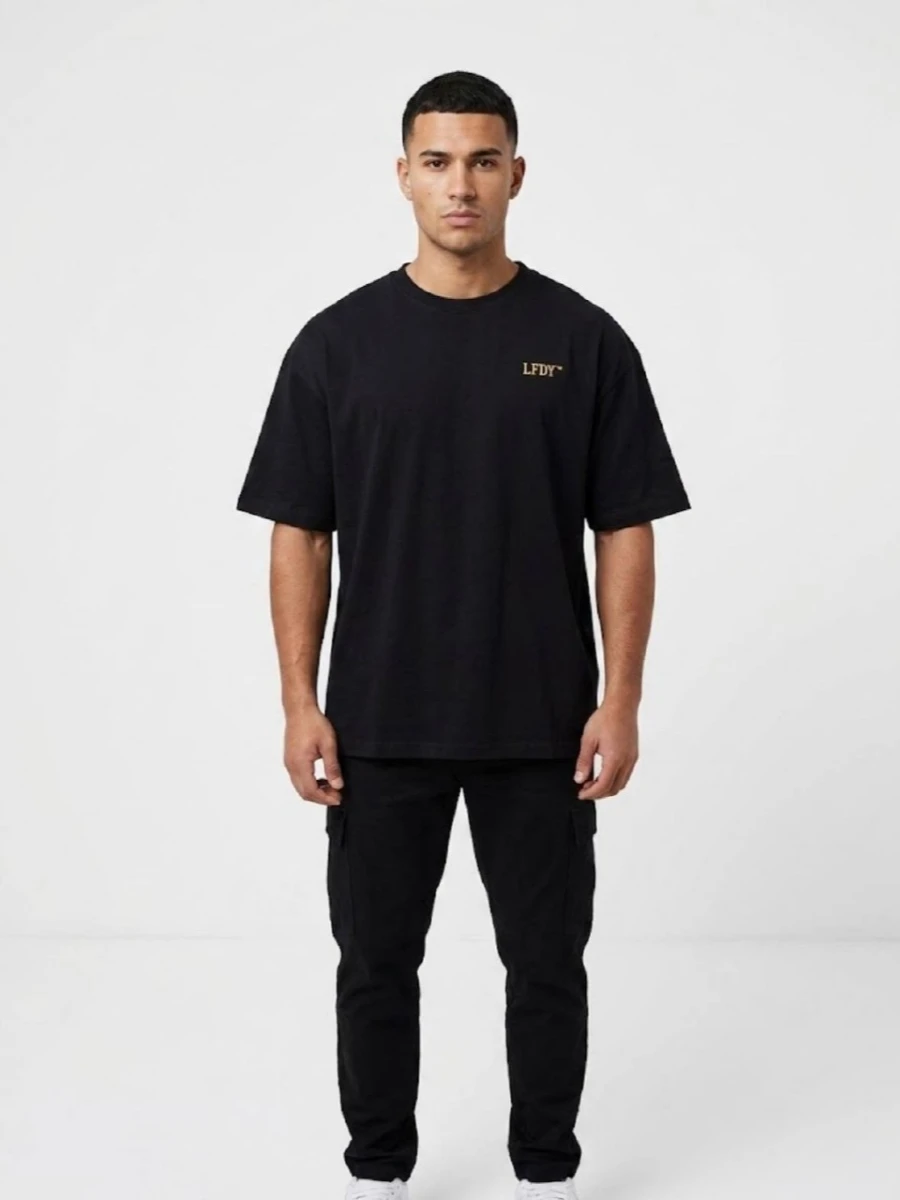 Men's black oversized T-shirt with a melting skull design تیشرت لش مردانه مشکی طرح اسکلت ذوب شده - تصویر 1